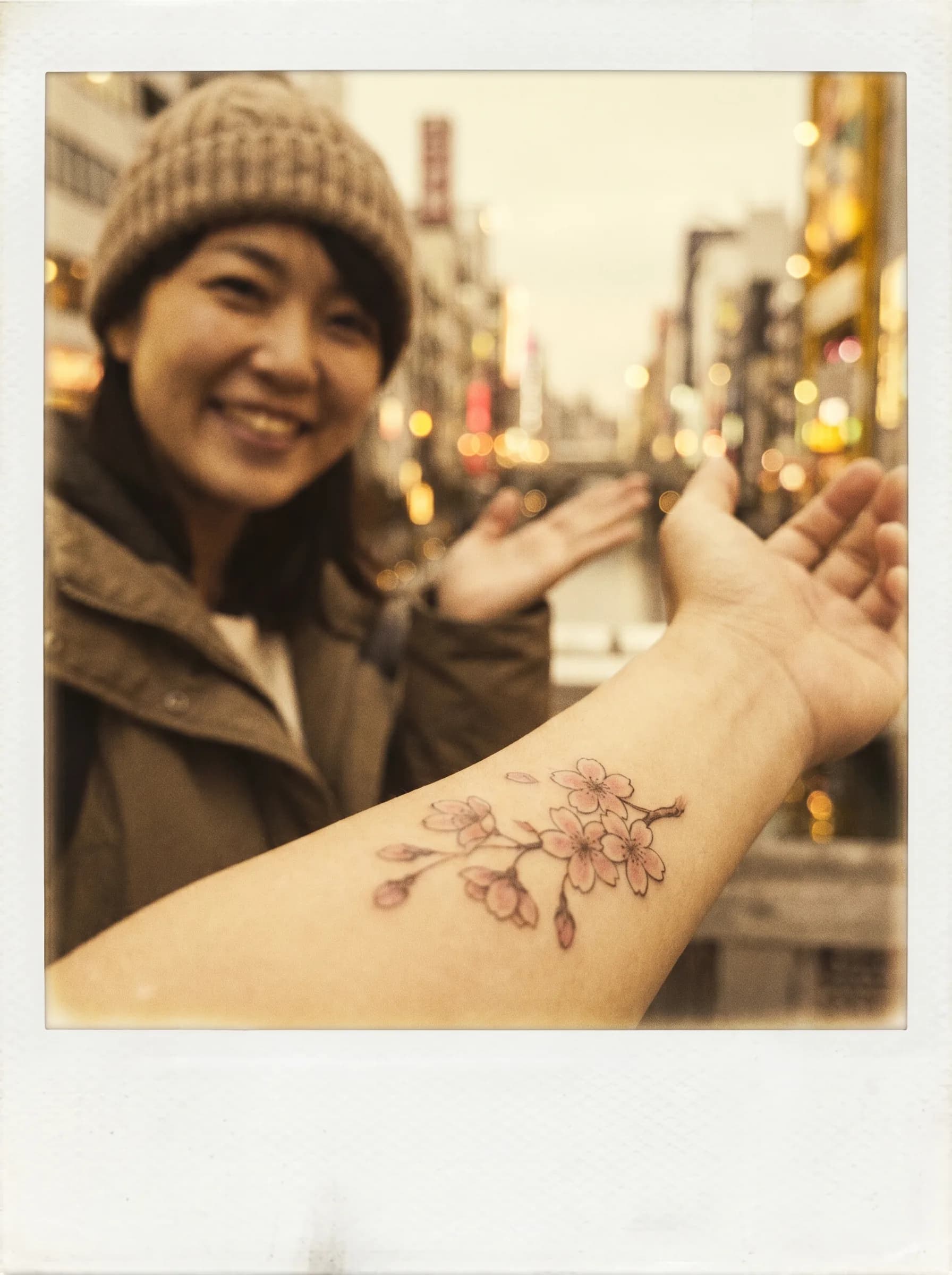 Traveler with fresh Japanese tattoo and polaroid in Osaka
